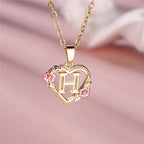 Collier avec pendentif initiale coeur et fleurs h