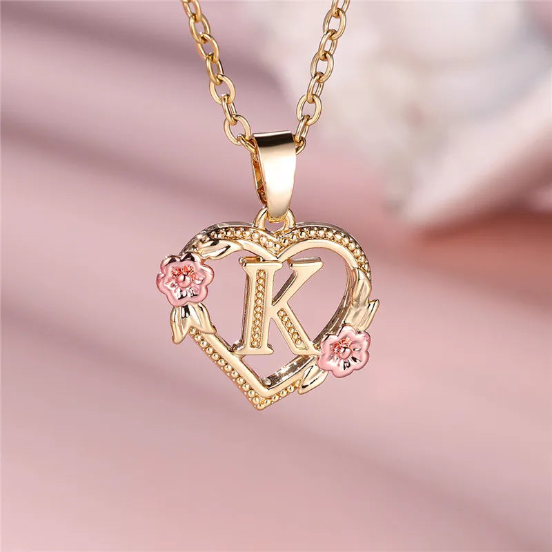 Necklace with heart and flower initial letter pendant
