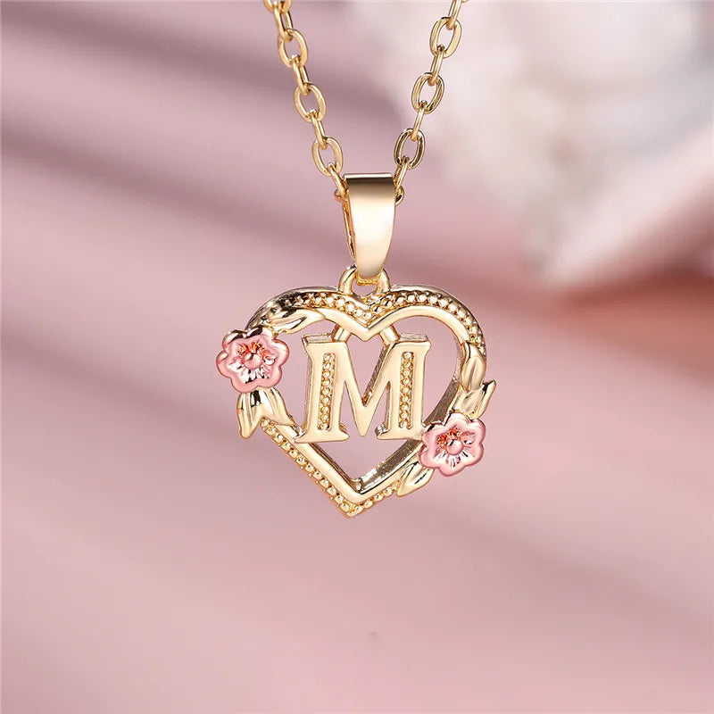 Necklace with heart and flower initial letter pendant