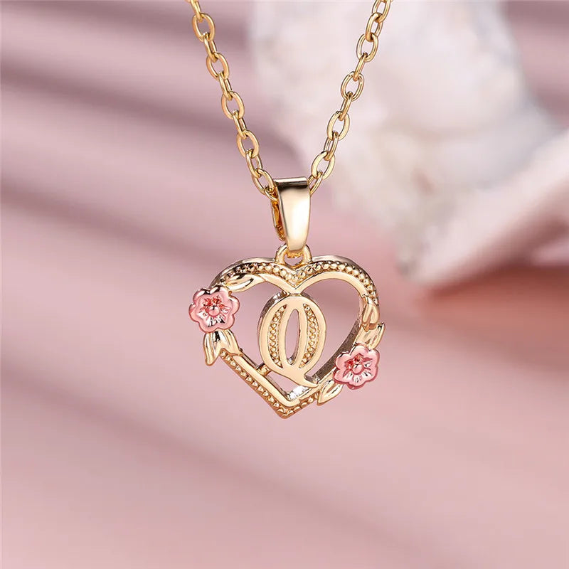 Necklace with heart and flower initial letter pendant