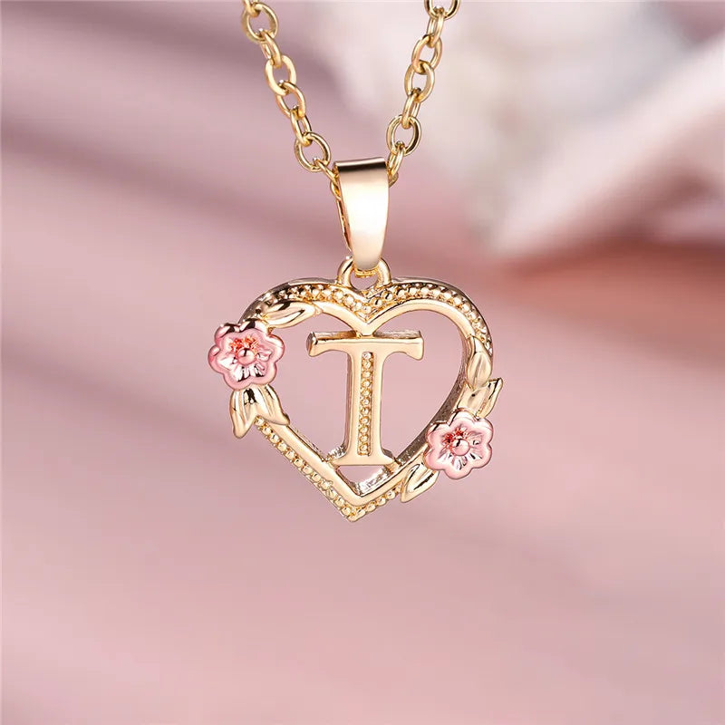 Necklace with heart and flower initial letter pendant