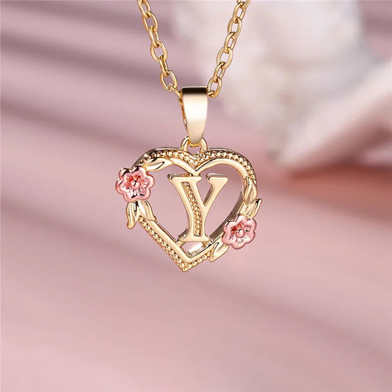 Necklace with heart and flower initial letter pendant