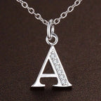 Necklace with initial letter pendant and rhinestones
