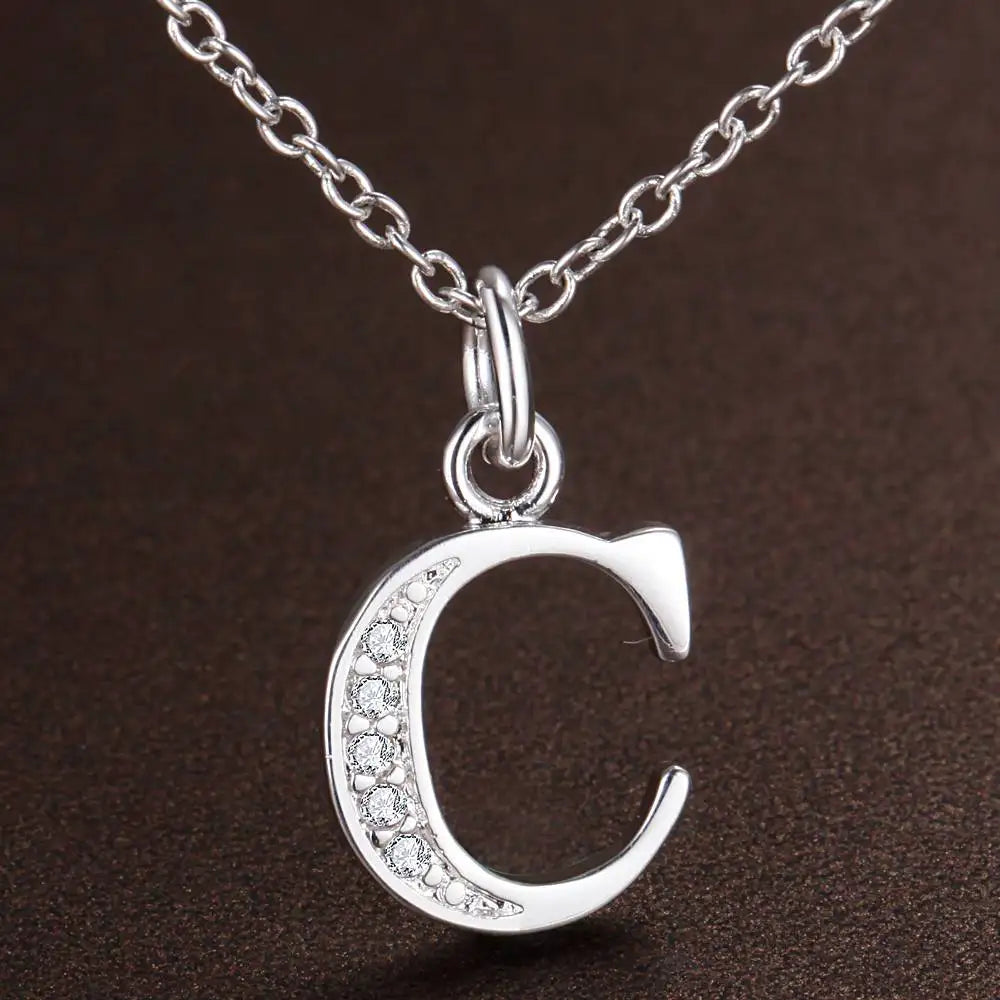 Necklace with initial letter pendant and rhinestones