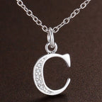 Necklace with initial letter pendant and rhinestones