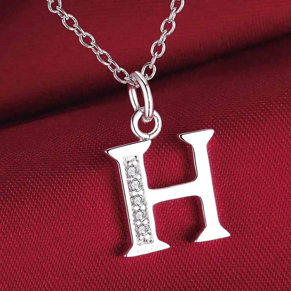 Necklace with initial letter pendant and rhinestones