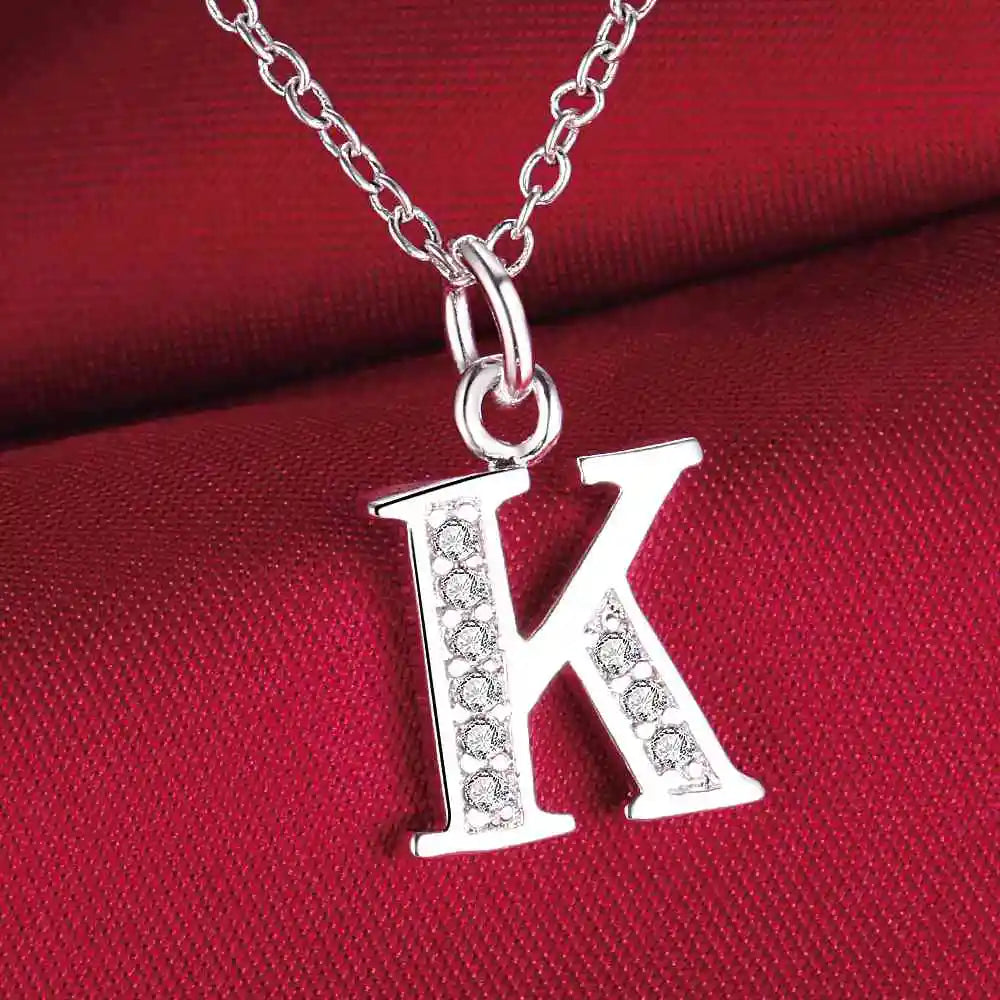 Necklace with initial letter pendant and rhinestones