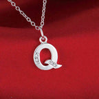 Necklace with initial letter pendant and rhinestones