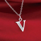 Necklace with initial letter pendant and rhinestones