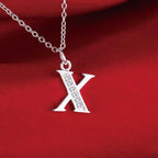 Necklace with initial letter pendant and rhinestones