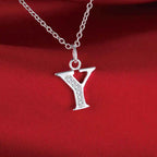 Necklace with initial letter pendant and rhinestones
