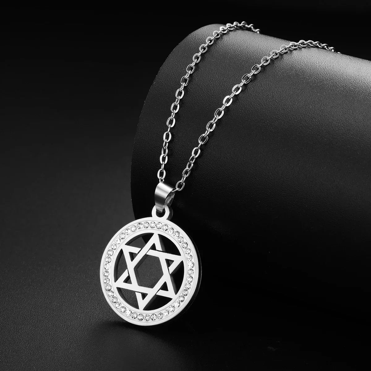 Necklace with round pendant featuring the Star of David symbol