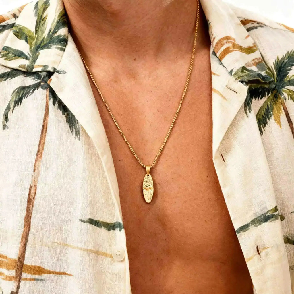 Collier avec petit pendentif palmier et mer or