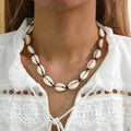 Collier coquillage cauri blanc noir