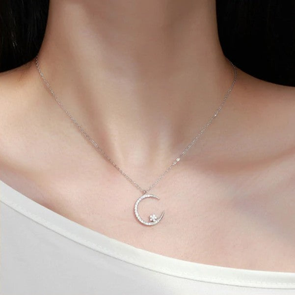 Shiny necklace with star and moon pendant