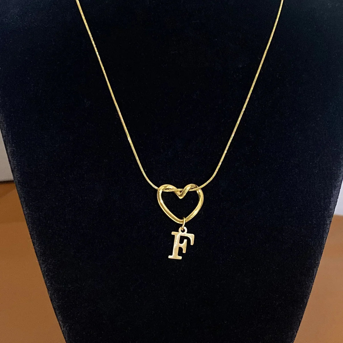 Choker necklace with initial letter and heart pendant