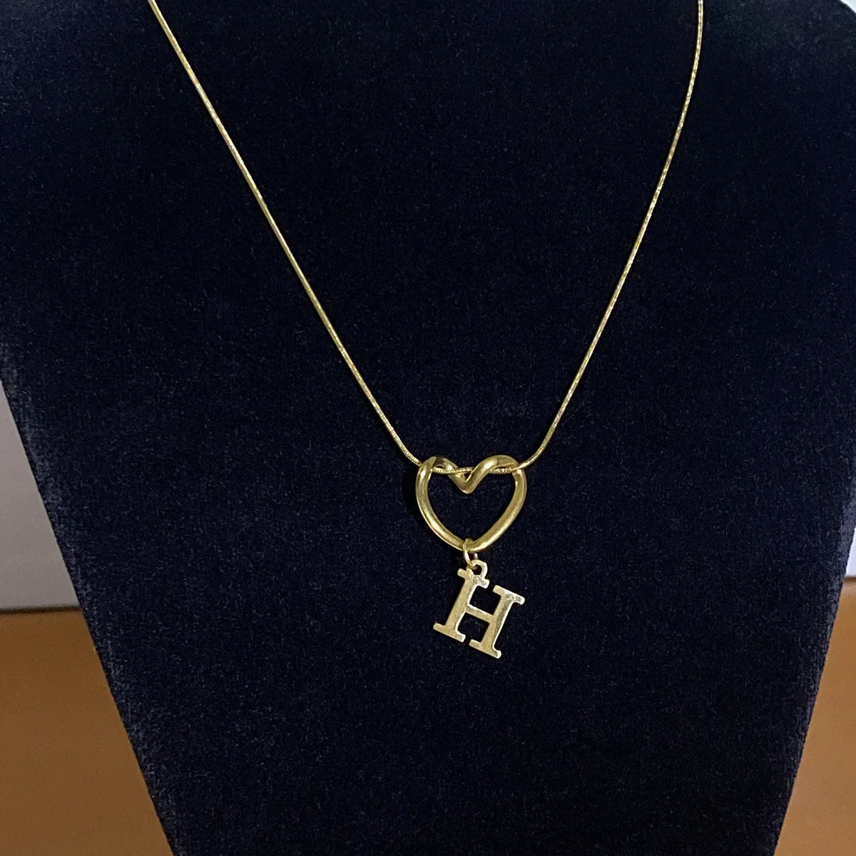 Choker necklace with initial letter and heart pendant