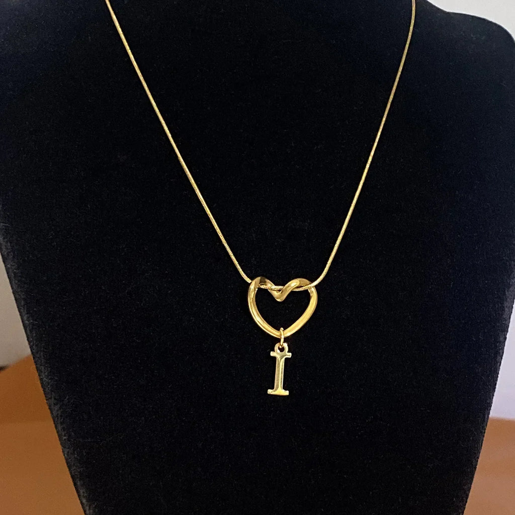 Choker necklace with initial letter and heart pendant