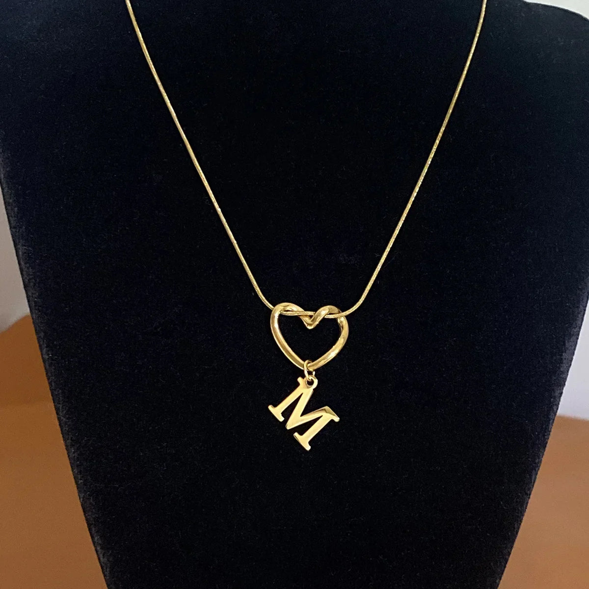 Choker necklace with initial letter and heart pendant