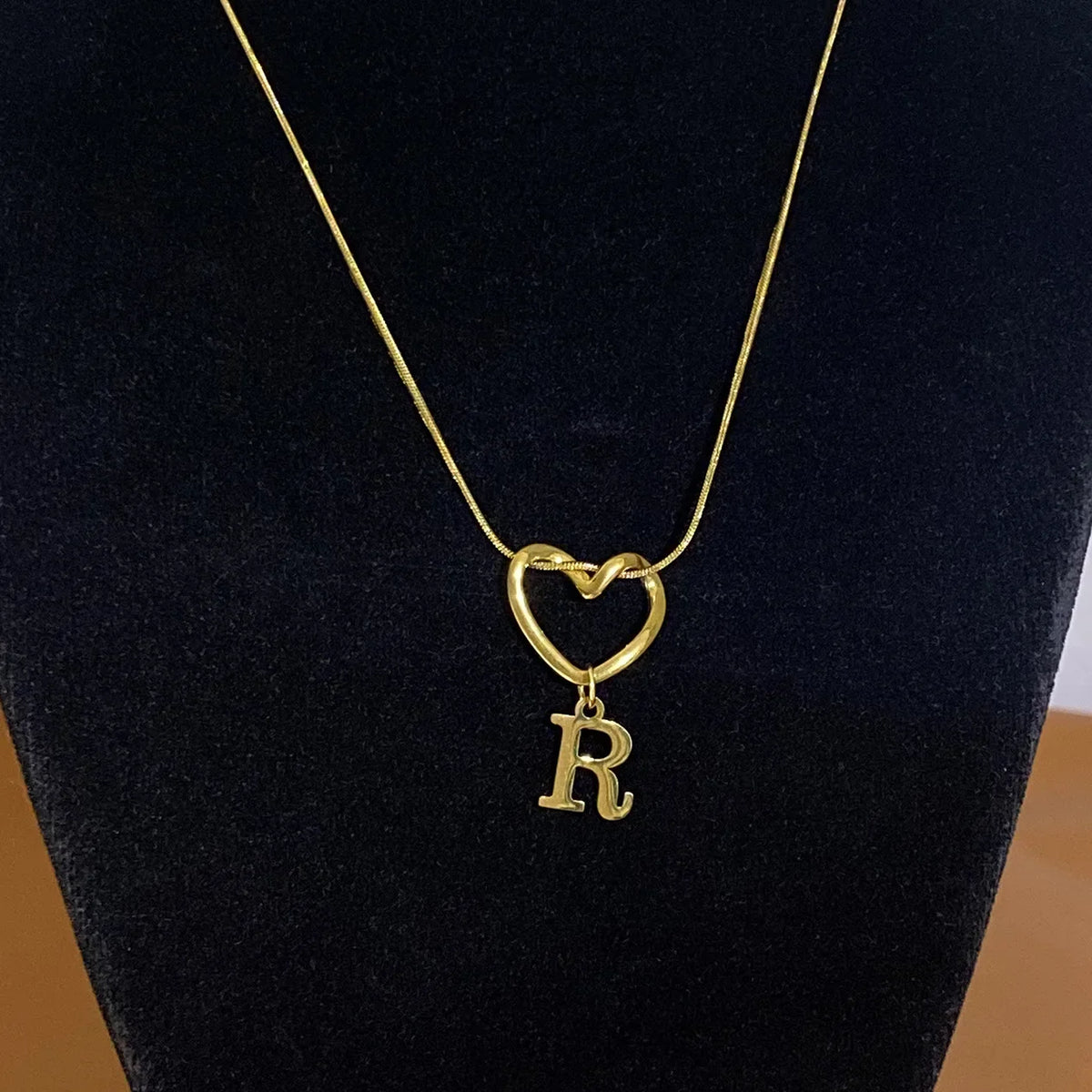Choker necklace with initial letter and heart pendant