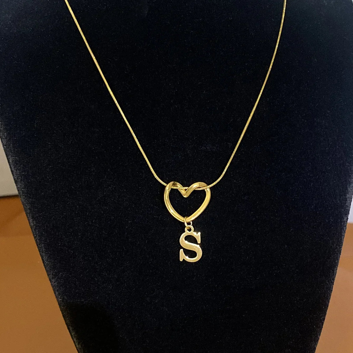 Choker necklace with initial letter and heart pendant