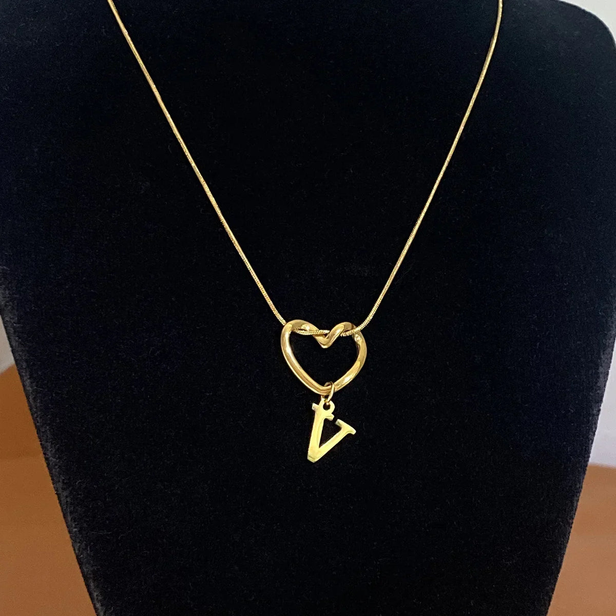 Choker necklace with initial letter and heart pendant