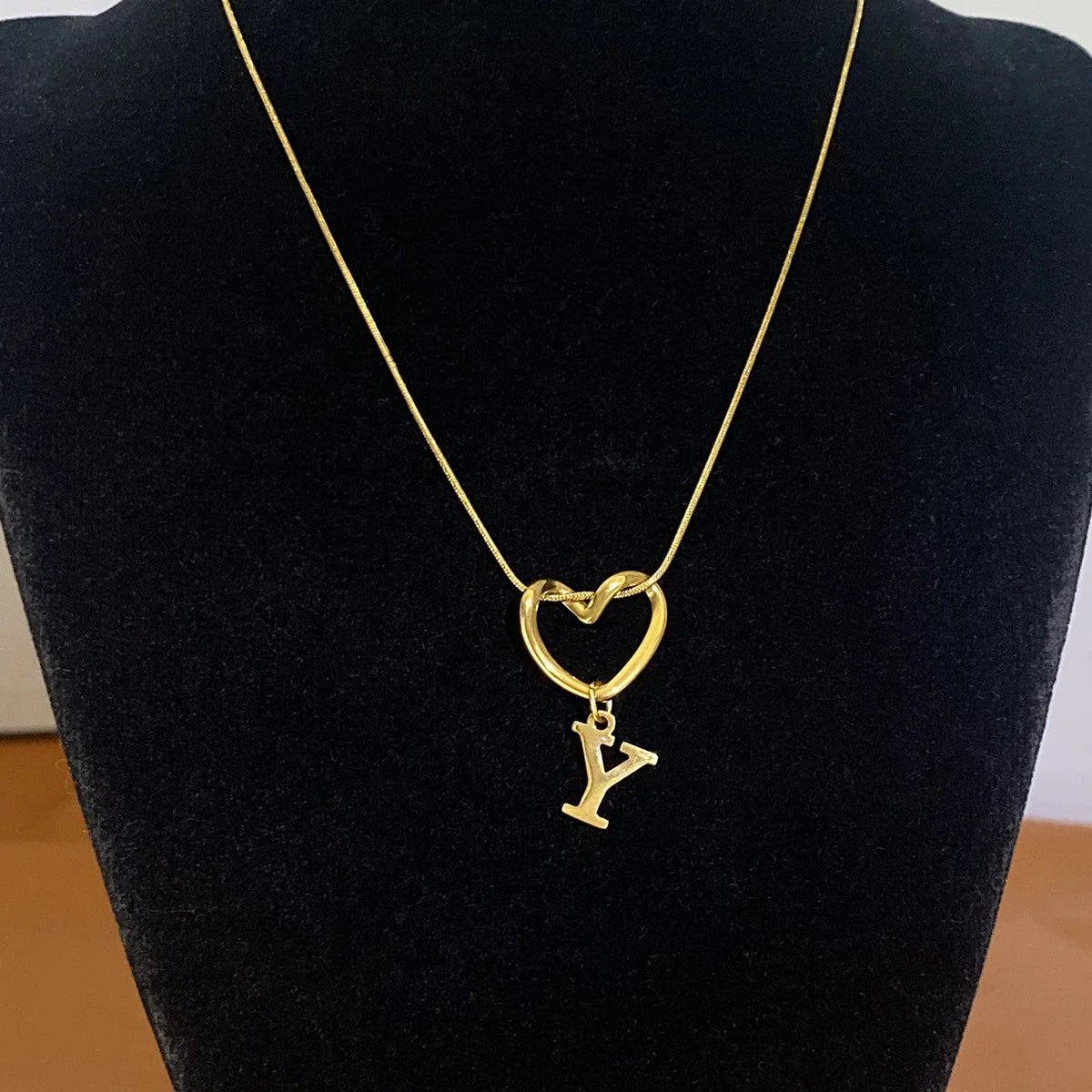 Choker necklace with initial letter and heart pendant