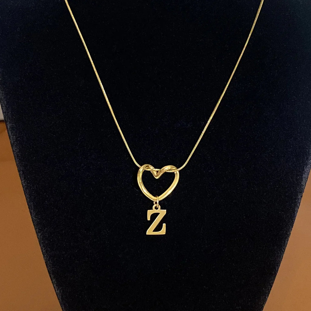 Choker necklace with initial letter and heart pendant