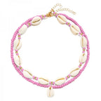 Double collier coquillage cauri rose