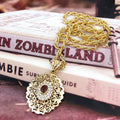 Collier long avec pendentif doré traditionnel arabe rouge