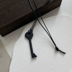 Long rope necklace with key pendant