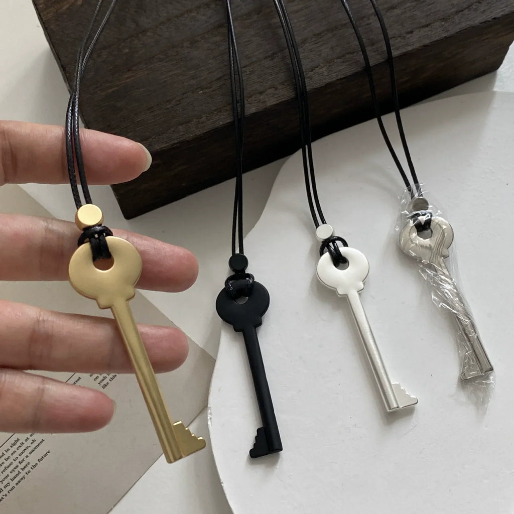Long rope necklace with key pendant