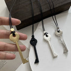 Long rope necklace with key pendant