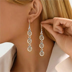 Longues boucles d'oreilles pendantes spirale